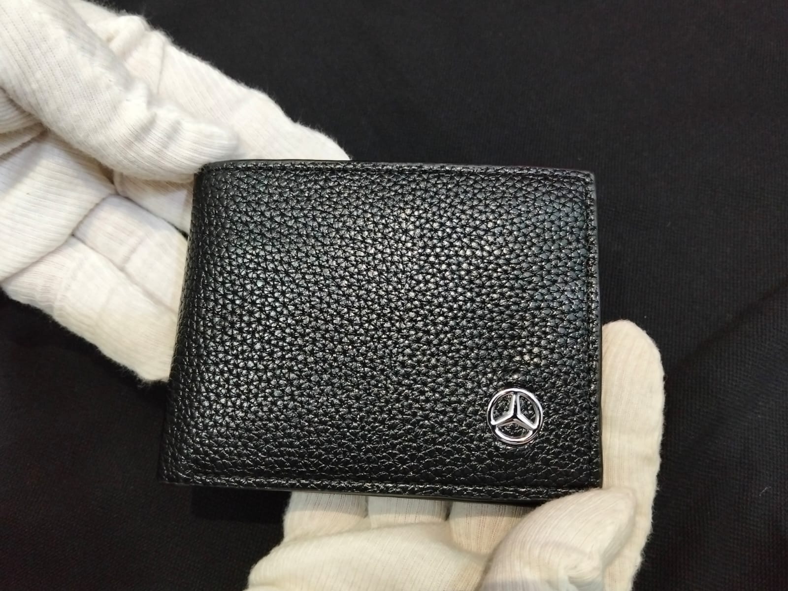 black wallet with batch